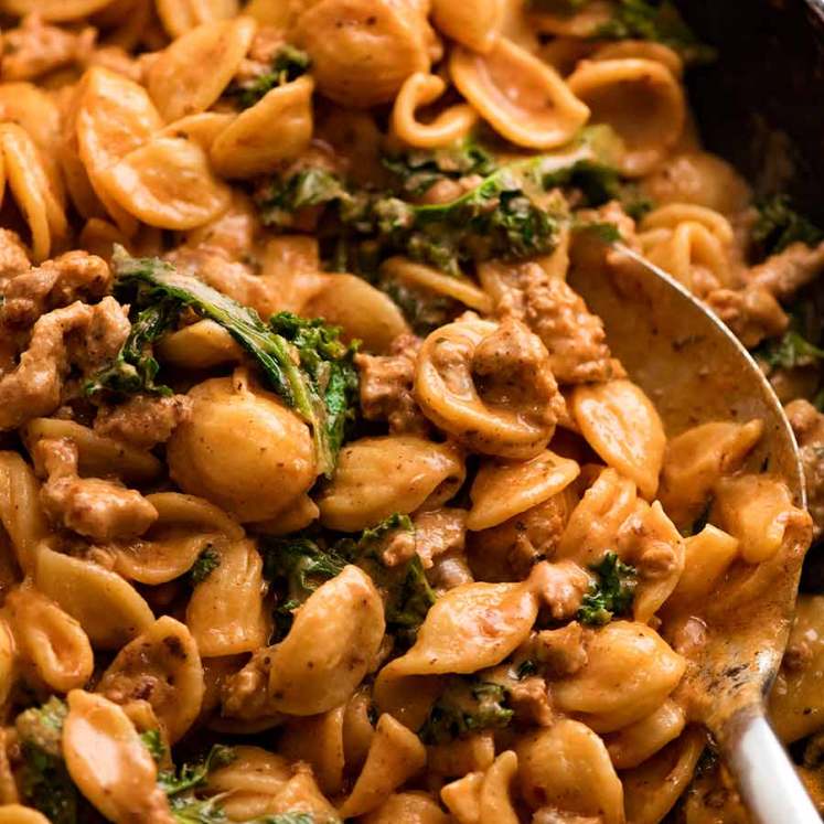 Close up of Orecchiette Sausage Pasta in Creamy Tomato Sauce in skillet, ready to be served